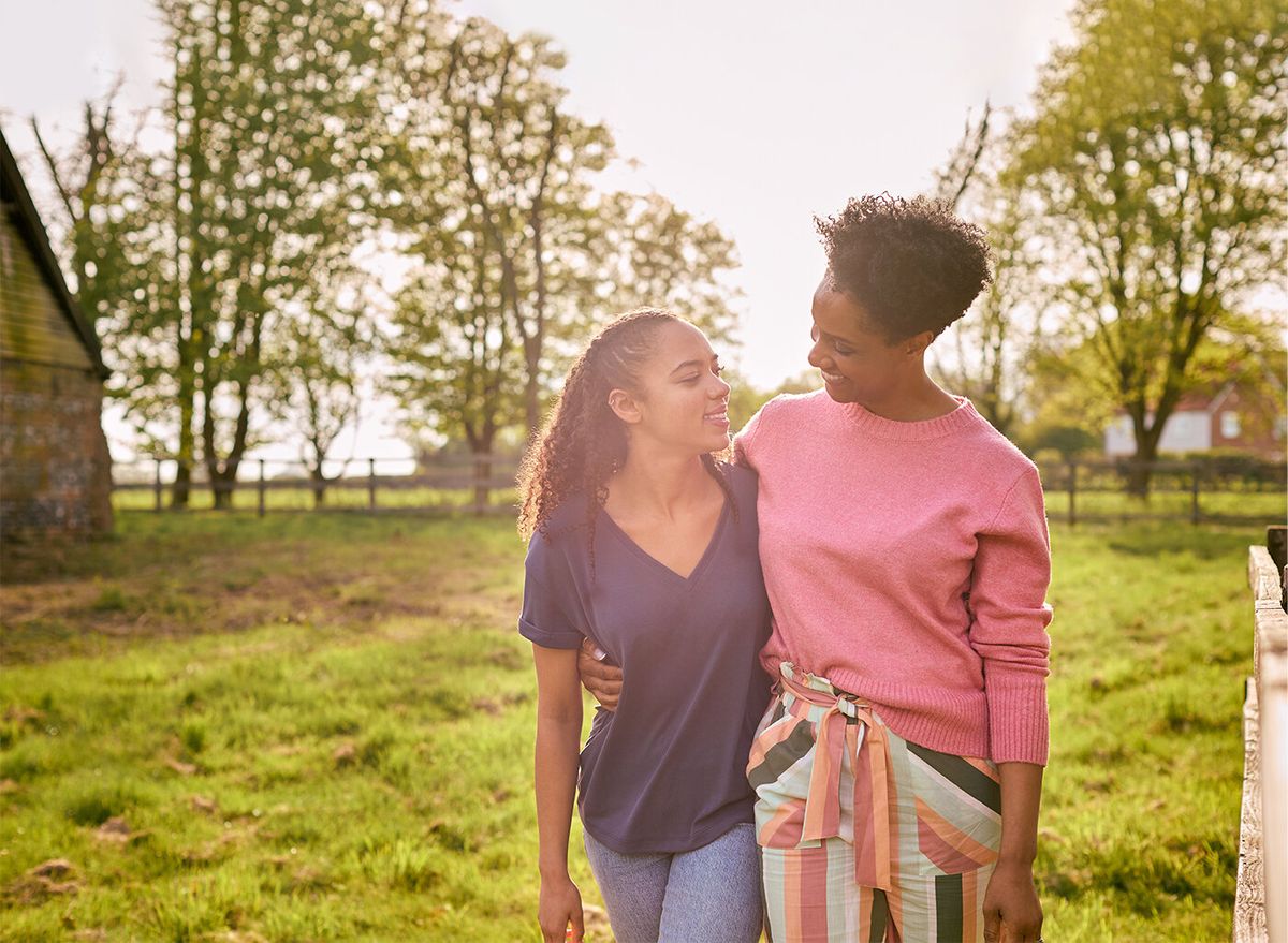 A parent and child together at golden hour